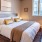a bedroom with a large window