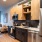 a kitchen with a fridge and a couch