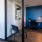 a room with a desk and chairs