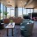 a room with a couch and chairs