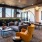 a room with a couch and chairs