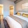 a bedroom with a bed and a desk