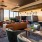 a room with a couch and chairs