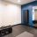 a room with blue walls and a black machine in it